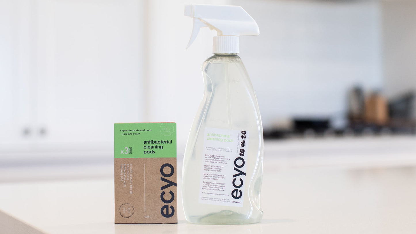 antibacterial spray bottle beside 3 refill pack of antibacterial cleaning pods