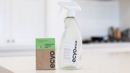 antibacterial spray bottle beside 3 refill pack of antibacterial cleaning pods